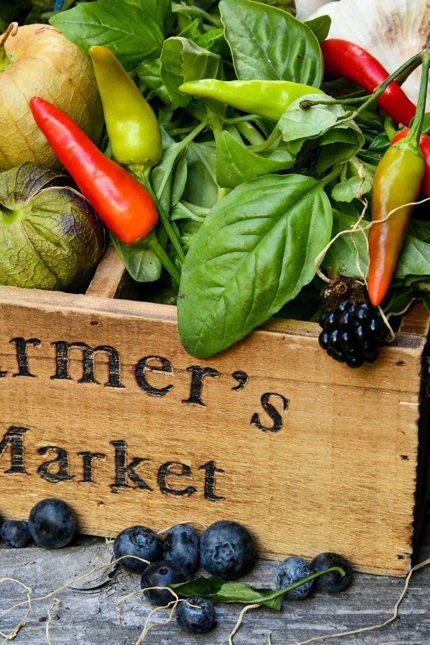 Wooden crate labeled Farmer's Market with vegetables