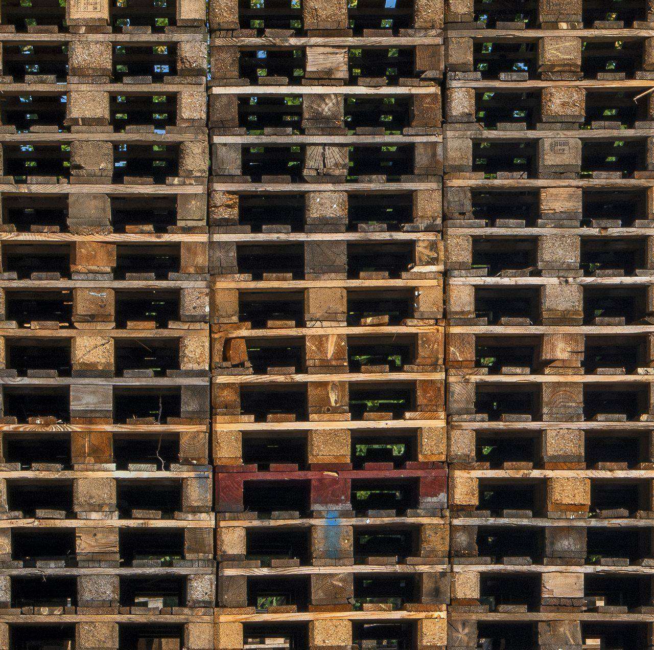 Overhead pattern of stacked wooden shipping pallets