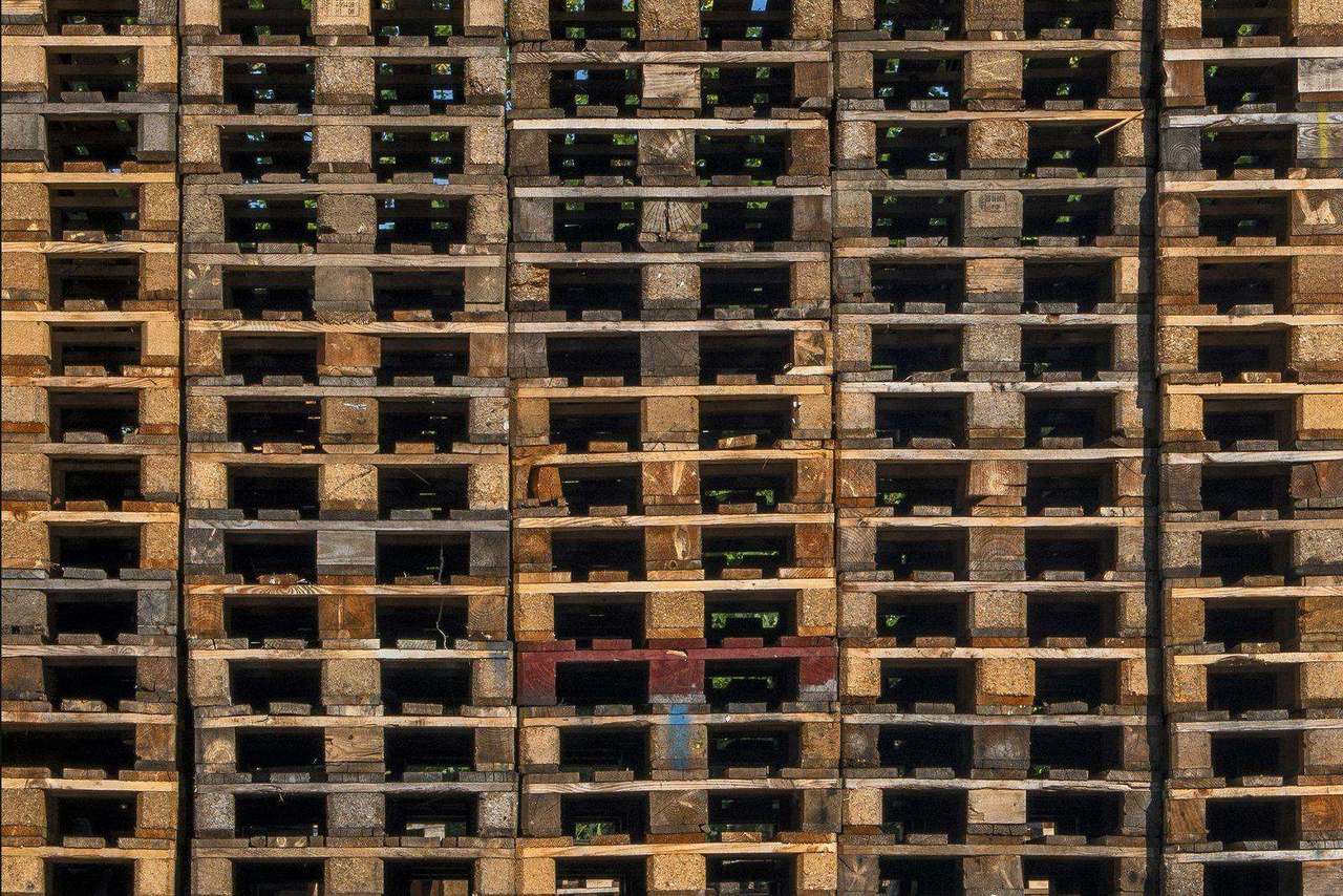 Overhead pattern of stacked wooden shipping pallets