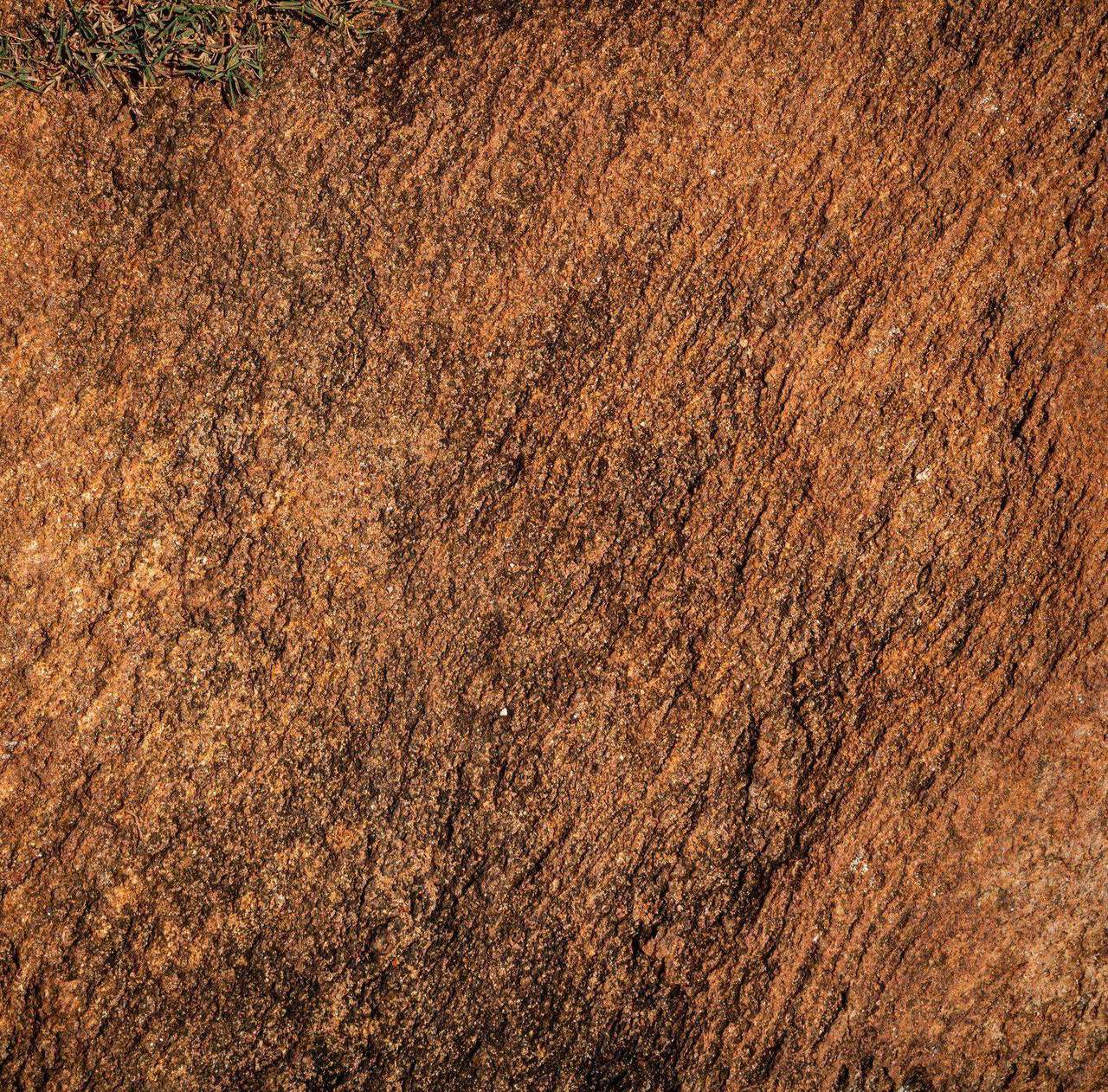 Close-up rust colored cracked earth texture