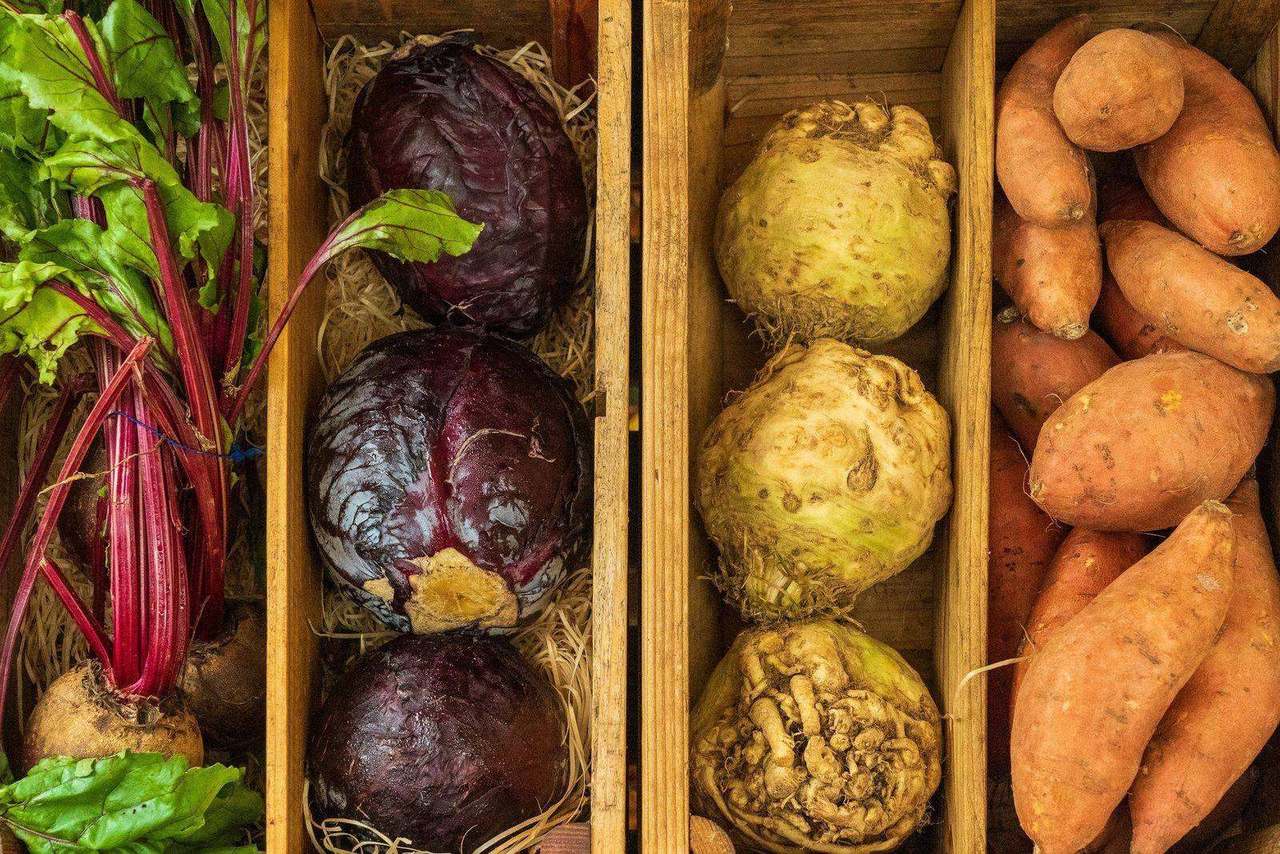 Wooden crates of beets celeriac and sweet potatoes